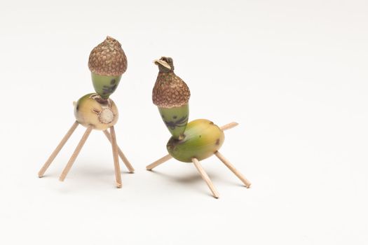Funny characters made by child from acorns and matches.