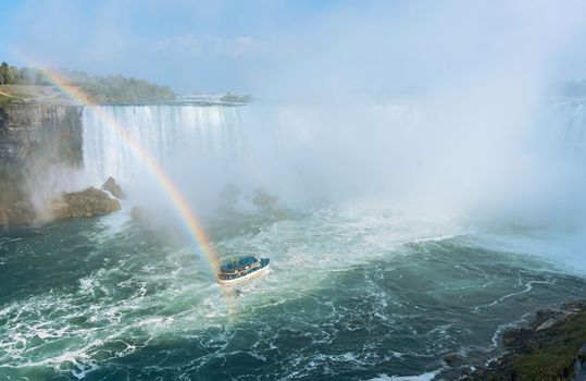 Rainbow rises from the mist at Horseshoe, Niagara Falls, Ontario, Canada