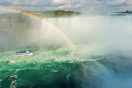 Rainbow rises from the mist at Horseshoe, Niagara Falls, Ontario, Canada