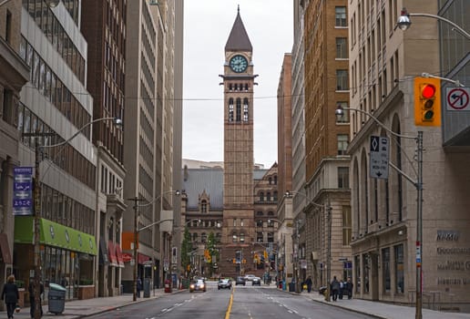 Toronto Ontario Canada, old city hall July 10, 2012. A view of the Old City Hall in TorontoPeople walking along Bay street and cars moving  on Sunday afternoon.