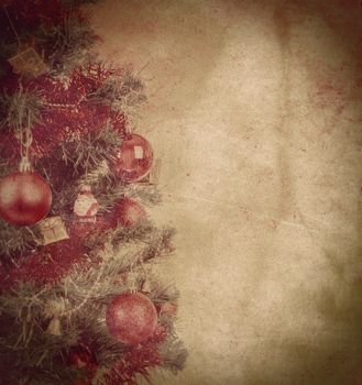 grunge textured christmas background with balls on tree 