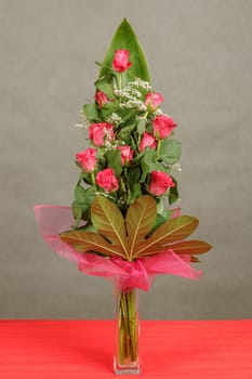 bouquet of eleven red roses in vase 