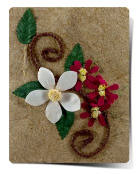 Mulburry Paper and white Artificial flower on mulberry paper background.