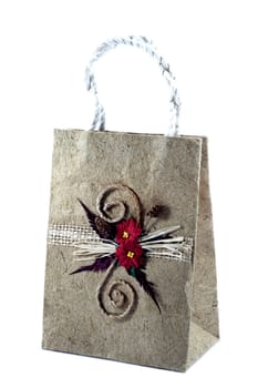 Brown mulberry paper bag isolated with flower.