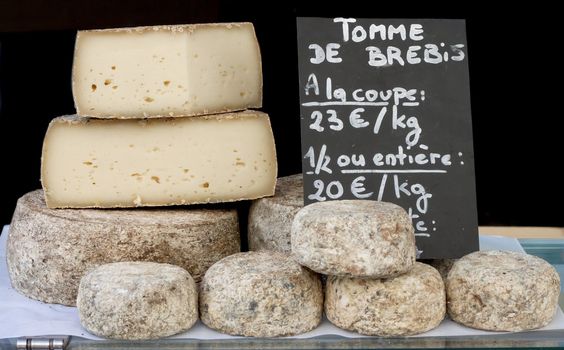 Stack of Biger France Cheese sale in the market.