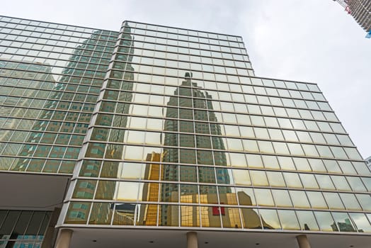 Toronto skyscrapers reflection on glass windows on Bay st 