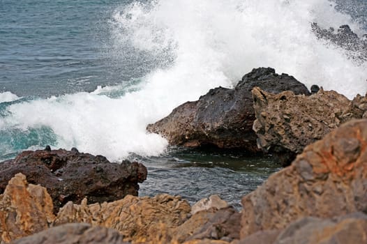 Breaking waves Against The Rocky Shore Of Big Island, Hawaii, USA