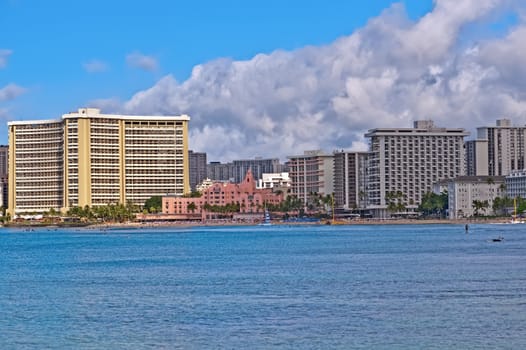 Cityscape Waikiki Beach, Honolulu Hawaii, USA.  Waikiki beach is a popular spot in the city of Honolulu to swim, surf, and relax