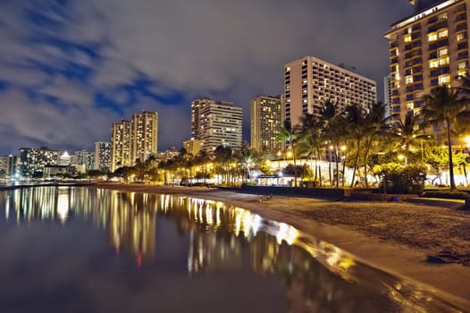 Cityscape Waikiki Beach, Honolulu Hawaii, USA.  Waikiki beach is a popular spot in the city of Honolulu to swim, surf, and relax