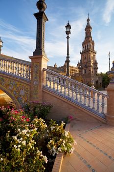 sunny with flowers Plaza de Espana in Sevilla, Spain