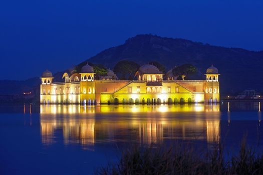 The palace Jal Mahal at night.  Jal Mahal (Water Palace) was built during the 18th century in the middle of Mansarovar Lake.  Jaipur, Rajasthan, India. 