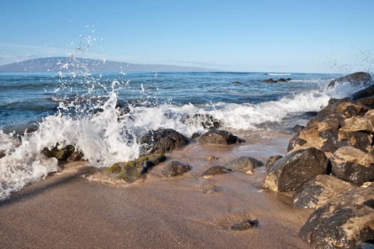 Rocks and sand along the  Bay on the island of Maui, Hawaii. 