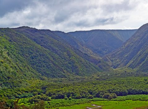 Pololu Beach on the Big Island of Hawaii. Passing the 28 mile marker on Highway 270 past Hawi it is a breathtaking view of Polulu Valley. It's a 30 minute hike over rough ground. But worth it