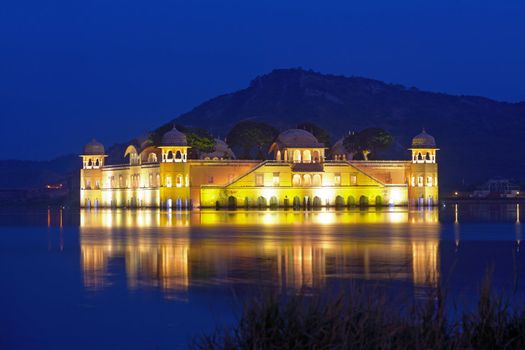 The palace Jal Mahal at night.  Jal Mahal (Water Palace) was built during the 18th century in the middle of Man Sager Lake.  Jaipur, Rajasthan, India.