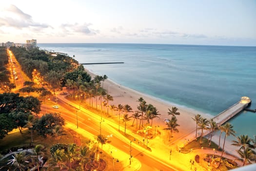 Oahu island Hawaii. Early morning Waikiki and Queen's Surf Beach aerial view.