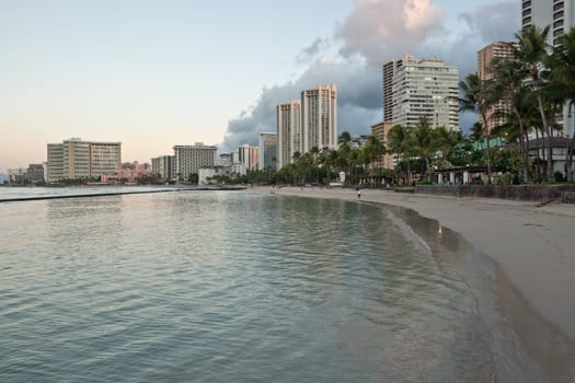 Cityscape Waikiki Beach, Honolulu Hawaii, USA.  Waikiki beach is a popular spot in the city of Honolulu to swim, surf, and relax