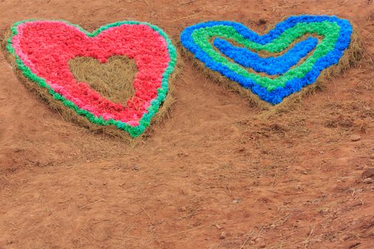 symbol of love - colour full heart on soil  background
