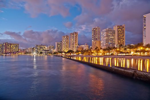 Cityscape Waikiki Beach, Honolulu Hawaii, USA.  Waikiki beach is a popular spot in the city of Honolulu to swim, surf, and relax