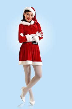 Portrait of beautiful young woman wearing santa claus clothes