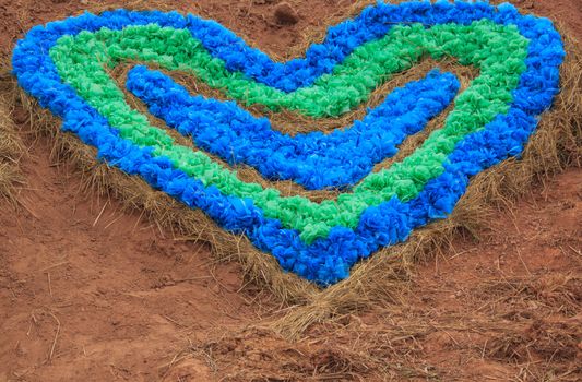 symbol of love - colour full heart on soil  background