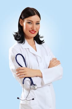 Portrait of happy successful young female doctor holding a stethoscope