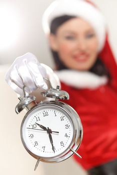 excited girl with santa hat holding clock. illustration