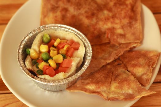 southern flat bread or crispy roti and breakfast on white plate