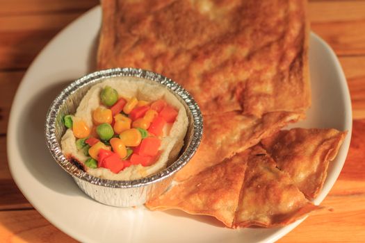 southern flat bread or crispy roti and breakfast on white plate