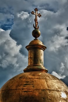 golden dome of the church against the sky