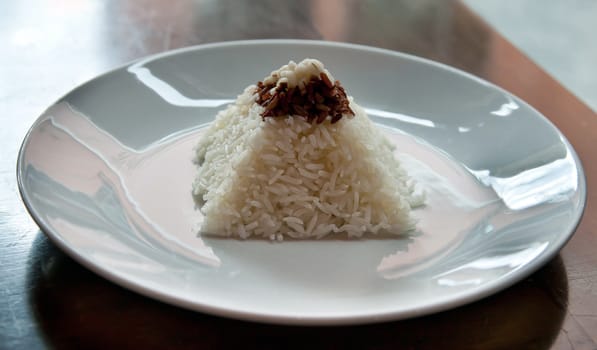 pyramid of rice on a plate in a restaurant