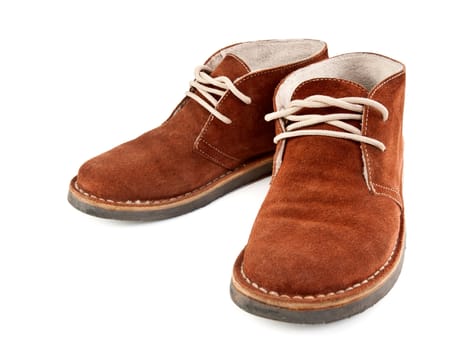 a pair of brown suede shoes isolated on white background