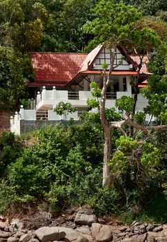 a lone house in the tropical jungles of Thailand