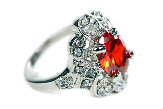 Silver ring with red stone on a white background