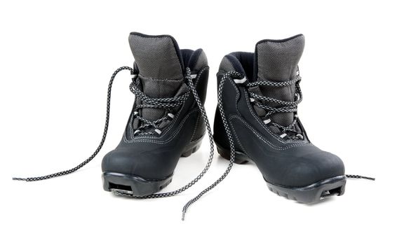 A pair of cross country ski boots isolated on white background