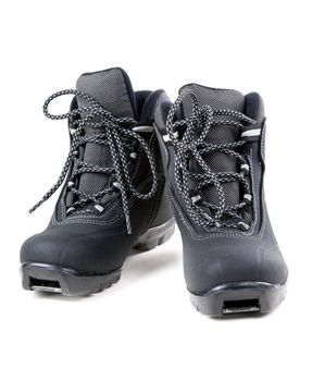 A pair of cross country ski boots isolated on white background