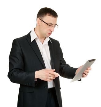 businessman with a tablet PC at a loss in the studio on a white background
