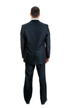 Businessman standing with his back to the studio, isolated on white