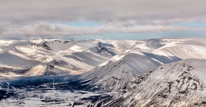 Landscape snowy mountain valley Khibiny