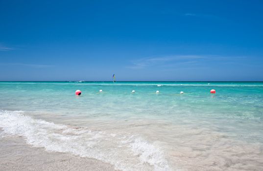 String of marker buoys in the water