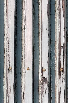 A background of closeup weathered white painted wood