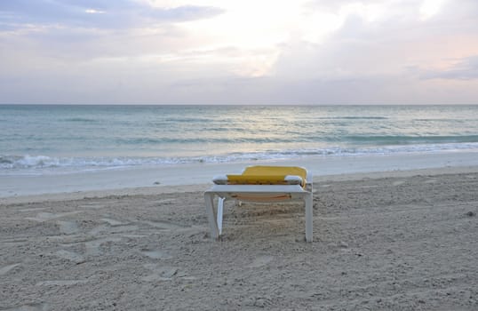 Beach, ocean, sunset and the Chair on the sand

