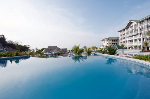 Photo of a swimming pool in a resort taken from a low angle