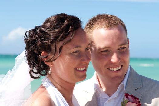 Husband and wife portrait with ocean landscape