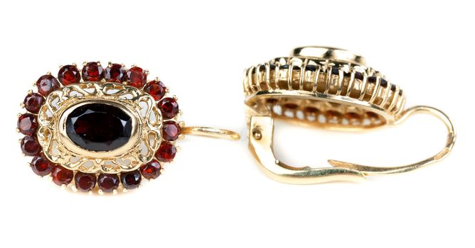 gold earrings with ruby ​​isolated on white