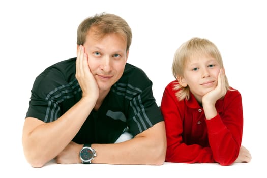 Happy family of two members lying on floor together against white background