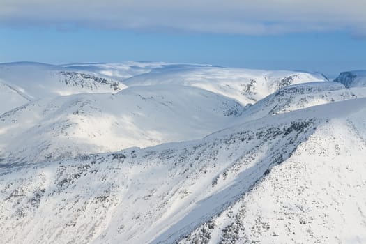 Beautiful snow-capped mountains against the blue sky