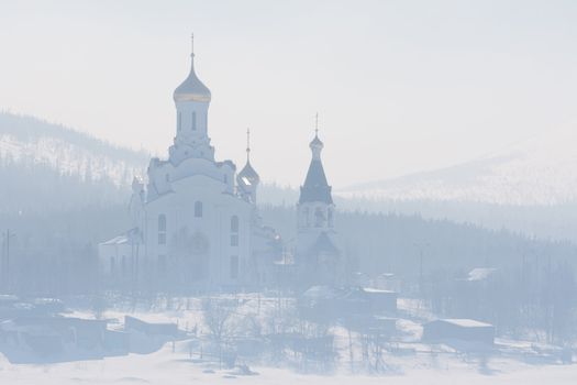 The Orthodox church with golden domes in the fog