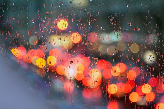 City at night in a glass with drops