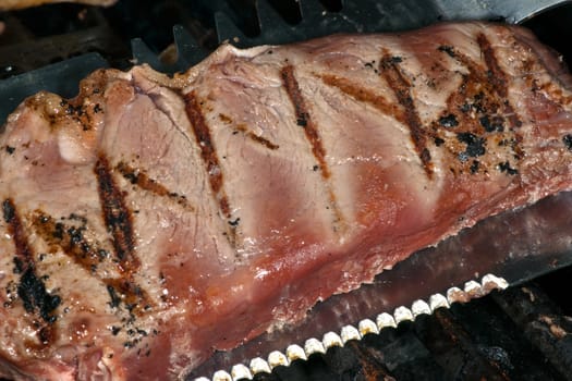 Close up of fillet steak in barbecue grill