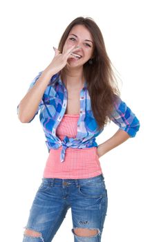 Girl licks her fingers in the cream of the cake
